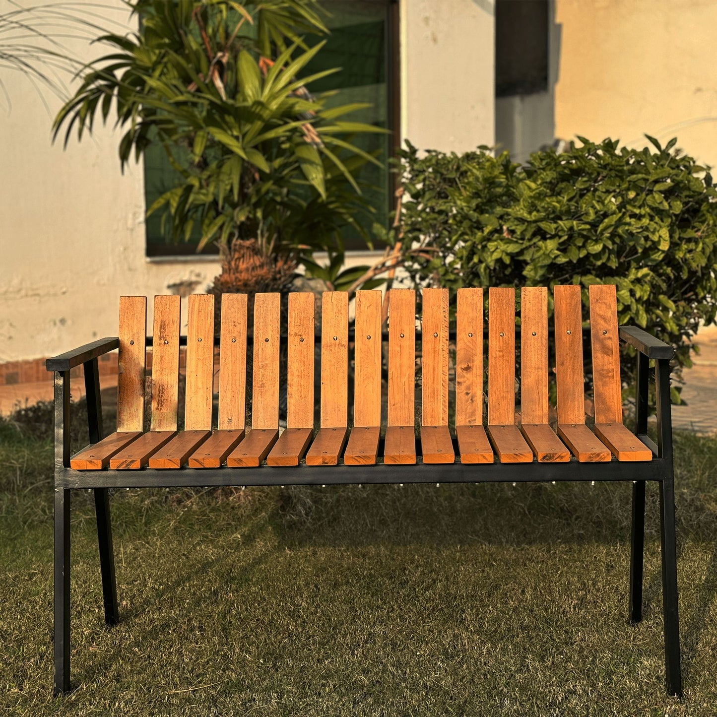 steel and wooden garden bench triangle shaped upfront